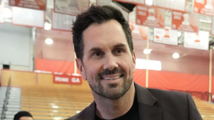 May 24, 2022; Santa Ana, California USA; Matt Leinart poses with a student during the Mater Dei High Heisman Homecoming ceremony at the Meruelo Athletic Center. Mandatory Credit: Kirby Lee-Imagn Images