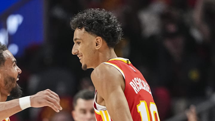Oct 23, 2024; Atlanta, Georgia, USA; Atlanta Hawks forward Zaccharie Risacher (10) reacts with guard Trae Young (11) after making a three point basket for his first points in the NBA against the Brooklyn Nets during the first half at State Farm Arena. Mandatory Credit: Dale Zanine-Imagn Images Oct 23, 2024; Atlanta, Georgia, USA; Atlanta Hawks forward Zaccharie Risacher (10) reacts with guard Trae Young (11) after making a three point basket for his first points in the NBA against the Brooklyn Nets during the first half at State Farm Arena. Mandatory Credit: Dale Zanine-Imagn Images