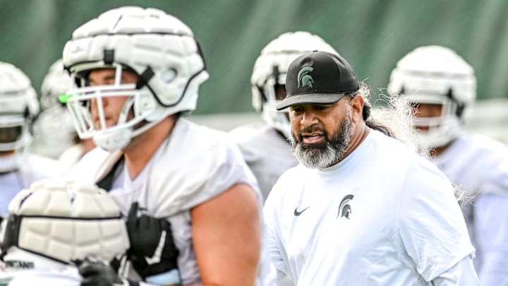 Michigan State's defensive line coach Legi Suiaunoa works with players during the first day of football camp on Tuesday, July 30, 2024, in East Lansing.