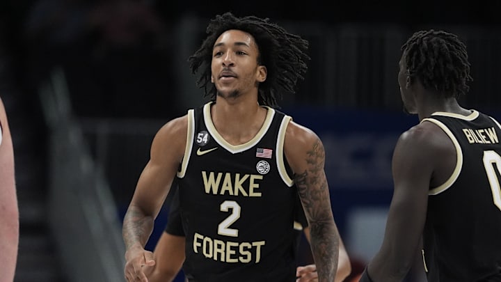 Mar 10, 2026; Charlotte, NC, USA;  Wake Forest Demon Deacons forward Juke Harris (2) and forward Omaha Biliew (0) react to a three point play during the first half against the Virginia Tech Hokies at Spectrum Center. Mandatory Credit: Jim Dedmon-Imagn Images