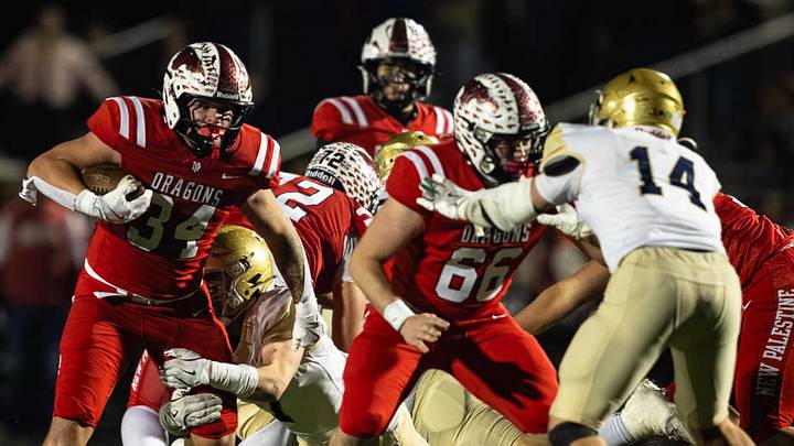New Palestine is pictured here against Cathedral in 2025. The Dragons lost to East Central in a 14-6 shocker last Friday night. New Palestine is pictured here against Cathedral in 2025. The Dragons lost to East Central in a 14-6 shocker last Friday night.