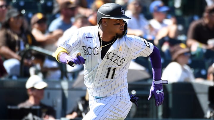 Sep 7, 2025; Denver, Colorado, USA; Colorado Rockies shortstop Orlando Arcia (11) scores during the third inning against the San Diego Padres at Coors Field. 