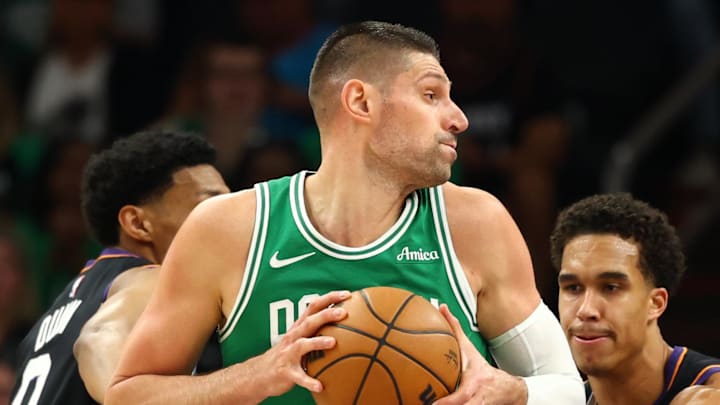 Feb 24, 2026; Phoenix, Arizona, USA; Boston Celtics center Nikola Vucevic (4) against the Phoenix Suns at Mortgage Matchup Center. Mandatory Credit: Mark J. Rebilas-Imagn Images