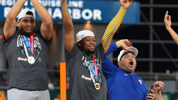 Mar 17, 2026; Miami, FL, United States; Venezuela outfielder Ronald Acuna Jr. (21) and teammates react after defeating the United States during the 2026 World Baseball Classic Championship game at loanDepot Park. Mandatory Credit: Sam Navarro-Imagn Images