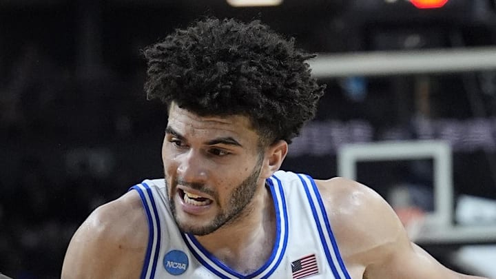 Mar 19, 2026; Greenville, SC, USA; Duke Blue Devils forward Cameron Boozer (12) dribbles the ball past Siena Saints forward Francis Folefac (11) in the second half during a first round game of the men's 2026 NCAA Tournament at Bon Secours Wellness Arena. Mandatory Credit: Jim Dedmon-Imagn Images Mar 19, 2026; Greenville, SC, USA; Duke Blue Devils forward Cameron Boozer (12) dribbles the ball past Siena Saints forward Francis Folefac (11) in the second half during a first round game of the men's 2026 NCAA Tournament at Bon Secours Wellness Arena. Mandatory Credit: Jim Dedmon-Imagn Images