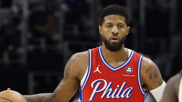 Feb 7, 2025; Detroit, Michigan, USA;  Philadelphia 76ers forward Paul George (8) dribbles the ball against the Detroit Pistons in the first half at Little Caesars Arena. Mandatory Credit: Rick Osentoski-Imagn Images
