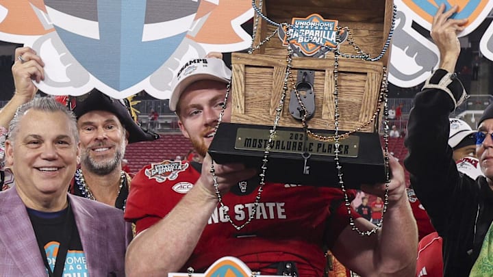 Dec 19, 2025; Tampa, FL, USA; NC State Wolfpack linebacker Caden Fordham (1) receives the MVP trophy after beating Memphis Tigers in the Gasparilla Bowl at Raymond James Stadium. Mandatory Credit: Nathan Ray Seebeck-Imagn Images Dec 19, 2025; Tampa, FL, USA; NC State Wolfpack linebacker Caden Fordham (1) receives the MVP trophy after beating Memphis Tigers in the Gasparilla Bowl at Raymond James Stadium. Mandatory Credit: Nathan Ray Seebeck-Imagn Images