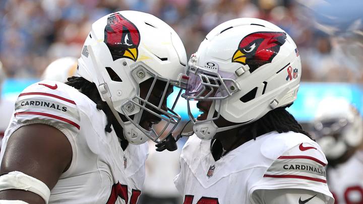 Sep 13, 2026; Inglewood, California, USA;  Arizona Cardinals defensive line L.J. Collier (91) reacts with cornerback Max Melton (16) after making a tackle against the Los Angeles Chargers during the fourth quarter at SoFi Stadium.  Mandatory Credit: Kiyoshi Mio-Imagn Images