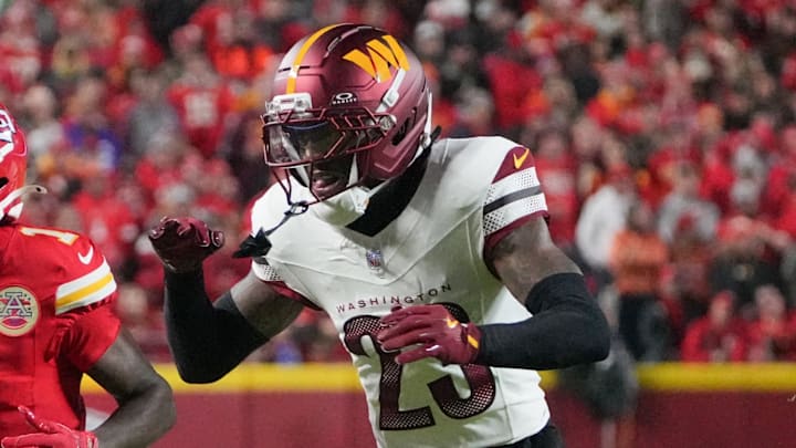 Oct 27, 2025; Kansas City, Missouri, USA; Kansas City Chiefs wide receiver Xavier Worthy (1) is unable to make a reception defended by Washington Commanders cornerback Trey Amos (23) during the first quarter of the game at GEHA Field at Arrowhead Stadium. Mandatory Credit: Denny Medley-Imagn Images