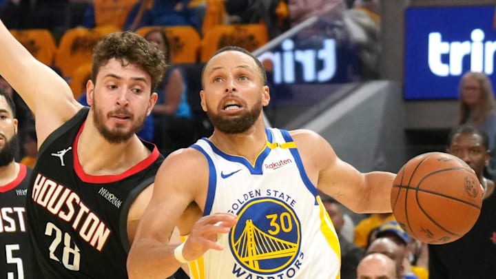Apr 26, 2025; San Francisco, California, USA; Golden State Warriors guard Stephen Curry (30) dribbles against Houston Rockets center Alperen Sengun (28) during the second quarter of game three of first round for the 2024 NBA Playoffs at Chase Center. Mandatory Credit: Darren Yamashita-Imagn Images