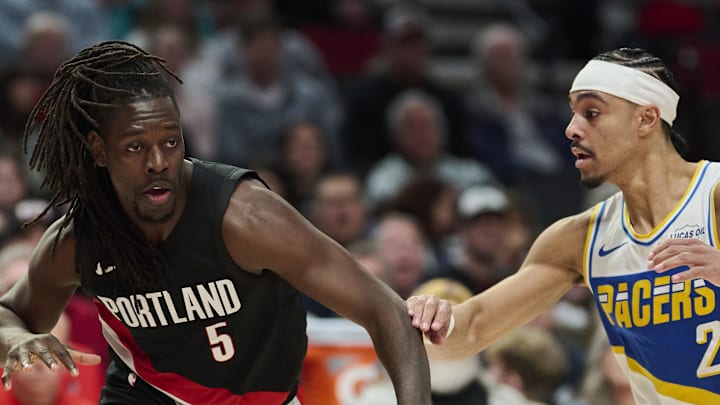 Portland Trail Blazers guard Jrue Holiday drives to the basket against Indiana Pacers guard Andrew Nembhard.
