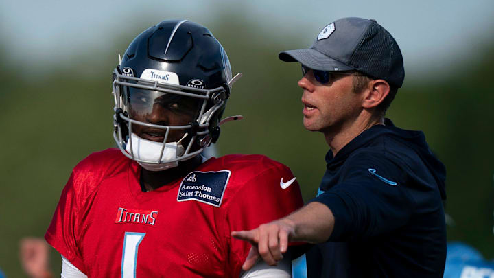 Tennessee Titans quarterback Cam Ward works with quarterbacks coach Bo Hardegree during training camp.