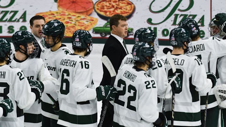 MSU hockey coach Adam Nightingale and his Spartans gather on the ice following MSU's 4-3 win over Notre Dame, Saturday, Nov. 15, 2024.