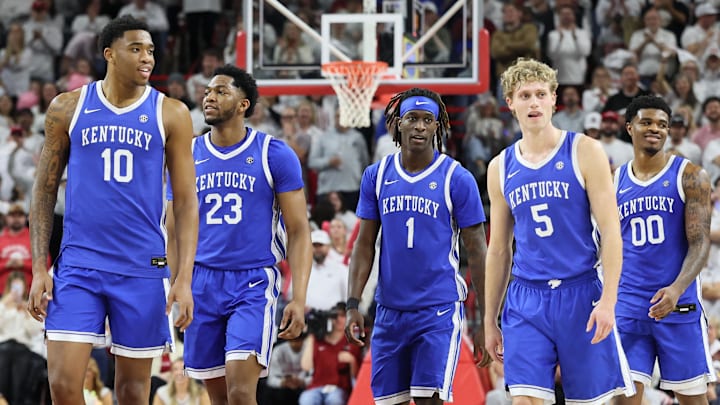 Jan 31, 2026; Fayetteville, Arkansas, USA; Kentucky Wildcats players return to the court after a timeout during the second half against the Arkansas Razorbacks at Bud Walton Arena. Kentucky won 85-77. Mandatory Credit: Nelson Chenault-Imagn Images