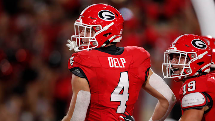 Georgia tight end Oscar Delp (4) celebrates after scoring touchdown during the first half of a NCAA college football game against Kentucky in Athens, Ga., on Saturday, Oct. 7, 2023.
