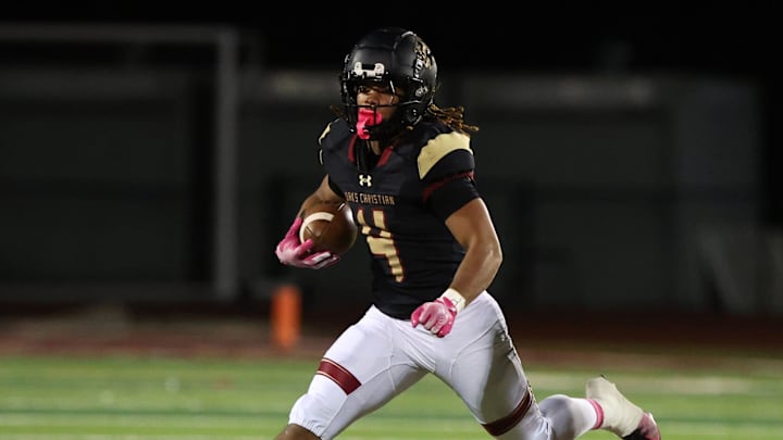 Running back Deshonne Redeaux looks for running room during the third quarter of Oaks Christian's 35-0 Marmonte League win over St. Bonaventure Friday night at Redell Field.