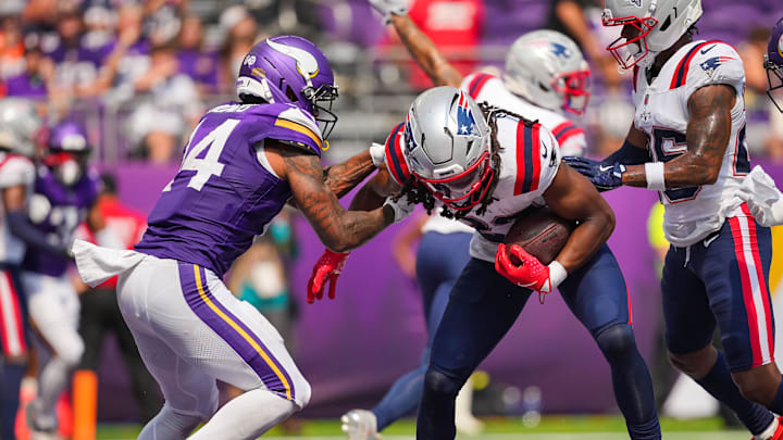Aug 16, 2025; Minneapolis, Minnesota, USA; New England Patriots safety Kyle Dugger (23) intercepts a pass against the Minnesota Vikings in the fourth quarter at U.S. Bank Stadium. Mandatory Credit: Brad Rempel-Imagn Images