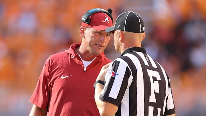Oct 19, 2024; Knoxville, Tennessee, USA; Alabama Crimson Tide head coach Kalen DeBoer speaks with an official during the first quarter against the Tennessee Volunteers at Neyland Stadium. Mandatory Credit: Randy Sartin-Imagn Images