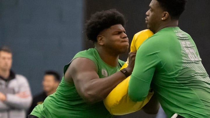 Oregon offensive lineman Josh Conerly Jr., left, runs drills with Oregon offensive lineman Marcus Harper II during the Oregon football’s Pro Day Tuesday, March 18, 2025, at the Moshofsky Center in Eugene, Ore.
