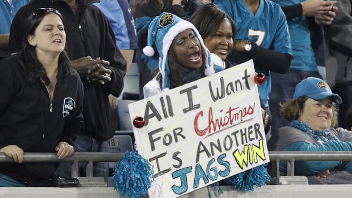 Dec 18, 2014; Jacksonville, FL, USA; Jacksonville Jaguars fan holds up a sign that says "All I Want for Christmas is a Jags Win." during the second quarter against the Tennessee Titans at EverBank Field. Mandatory Credit: Kim Klement-Imagn Images