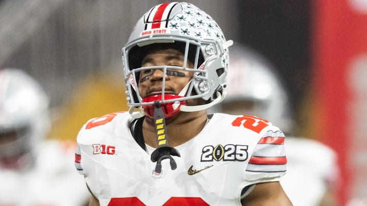 Jan 20, 2025; Atlanta, GA, USA; Ohio State Buckeyes running back James Peoples (20) against the Notre Dame Fighting Irish during the CFP National Championship college football game at Mercedes-Benz Stadium. Mandatory Credit: Mark J. Rebilas-Imagn Images