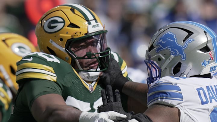 Green Bay Packers offensive tackle Zach Tom (50) blocks Detroit Lions defensive tackle Marcus Davenport.