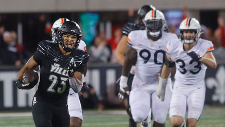Louisville's Isaac Guerendo ran for a touchdown against Virginia in L&N Stadium. 