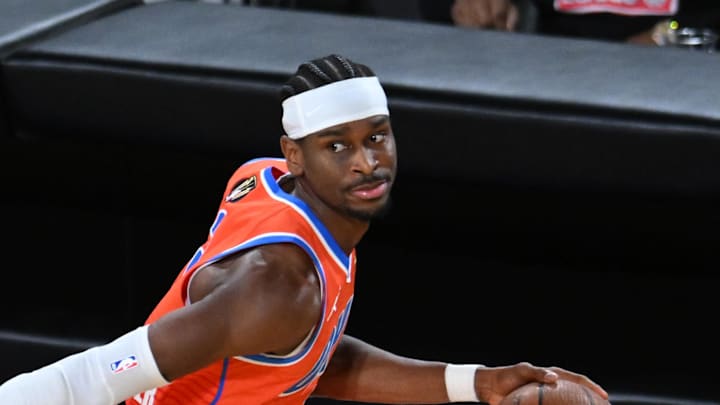 Dec 14, 2024; Las Vegas, Nevada, USA; Oklahoma City Thunder guard Shai Gilgeous-Alexander (2) controls the ball against Houston Rockets guard Fred VanVleet (5) during the fourth quarter in a semifinal of the 2024 Emirates NBA Cup at T-Mobile Arena. Mandatory Credit: Candice Ward-Imagn Images