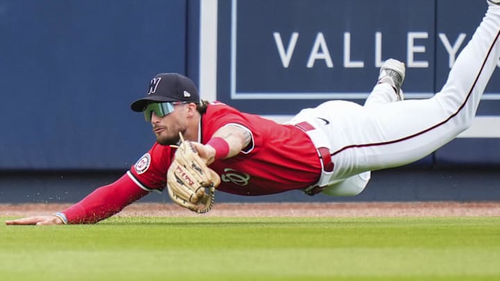 Mar 4, 2025; West Palm Beach, Florida, USA; Washington Nationals outfielder Dylan Crews (3) catches a fly ball for an out against the St. Louis Cardinals during the second inning at CACTI Park of the Palm Beaches.