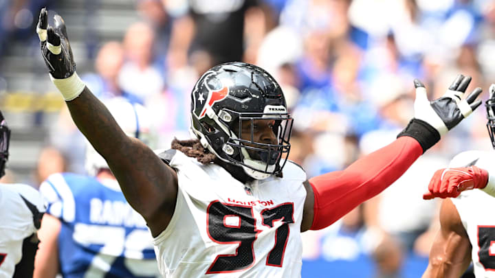 Sep 8, 2024; Indianapolis, Indiana, USA; Houston Texans defensive end Mario Edwards Jr. (97) celebrates a sack during the second quarter against the Indianapolis Colts at Lucas Oil Stadium. Mandatory Credit: Marc Lebryk-Imagn Images