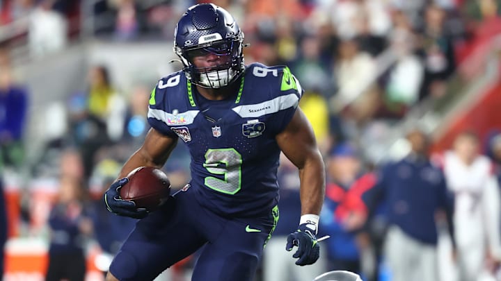 Feb 8, 2026; Santa Clara, CA, USA; Seattle Seahawks running back Kenneth Walker III (9) runs against New England Patriots linebacker Anfernee Jennings (33) during the fourth quarter in Super Bowl LX at Levi's Stadium. 
