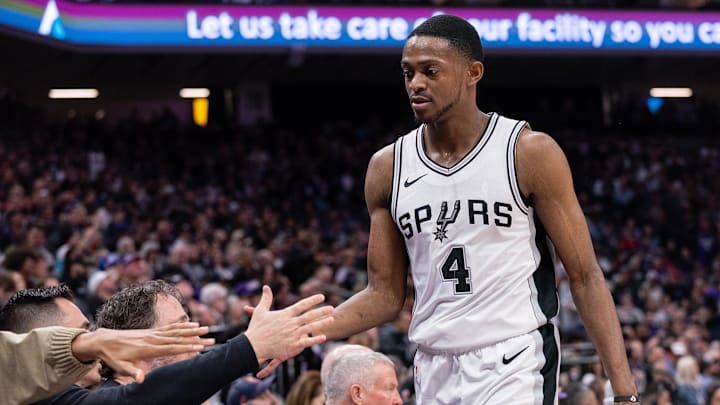 Mar 7, 2025; Sacramento, California, USA; San Antonio Spurs guard De'Aaron Fox (4) high fives team mates after coming out of the game during the fourth quarter at Golden 1 Center.