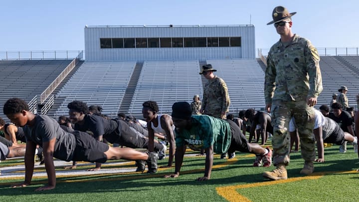 U.S. Army Soldiers from III Armored Corps provide DeSoto High School Football players a basic training style team building exercise in DeSoto, Texas, July 30, 2025. DeSoto High School's football team is known for its strong recent performance, including winning back-to-back state championships in 2022 and 2023.