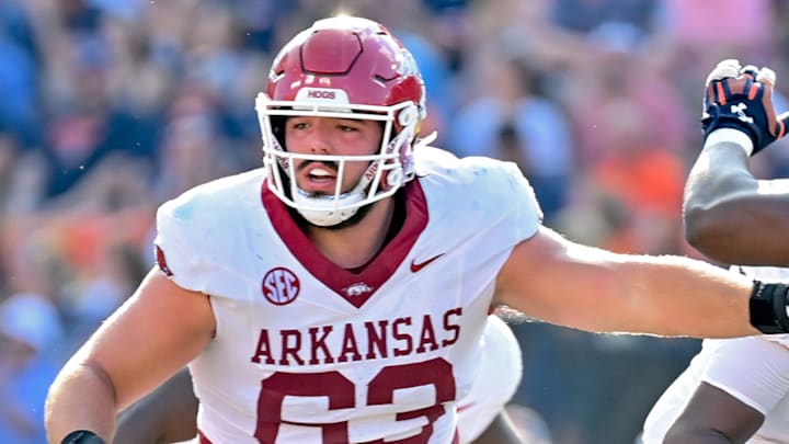 Arkansas Razorbacks center Addison Nichols blocking against the Auburn Tigers at Jordan-Hare Stadium in Auburn, Ala.