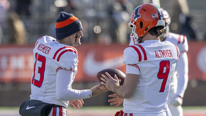 Jan 31, 2026; Mobile, AL, USA; American quarterbacks Garrett Nussmeier (13) of LSU and Luke Altmyer (9) of Illinois hang out between breaks during the first half of the 2026 Senior Bowl at University of South Alabama, Hancock Whitney Stadium. Mandatory Credit: Vasha Hunt-Imagn Images