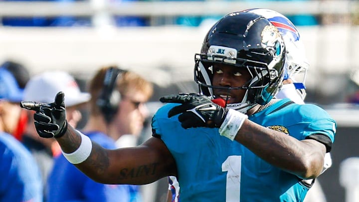 Jacksonville Jaguars running back Travis Etienne Jr. (1) signals a first down during the third quarter in an NFL football AFC Wild Card playoff matchup, Sunday, Jan. 11, 2026, in Jacksonville, Fla. Bills lead 10-7 at the half over the Jaguars. The Bills defeated the Jaguars 27-24. 