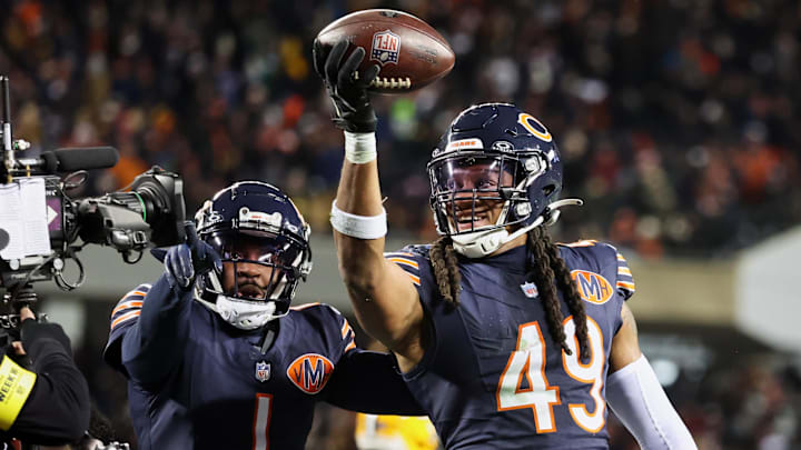 Dec 20, 2025; Chicago, Illinois, USA; Chicago Bears linebacker Tremaine Edmunds (49) poses for a television camera with cornerback Jaylon Johnson (1) after recovering a fumble against the Green Bay Packers during the third quarter at Soldier Field. Mandatory Credit: Mike Dinovo-Imagn Images