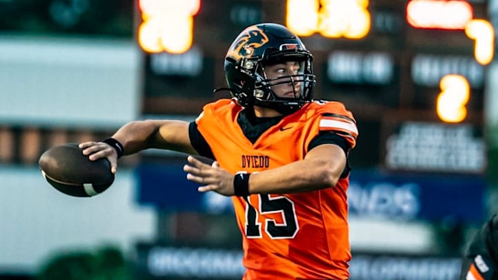 Oviedo quarterback Sebastian Galeano (15), shown here in a game last fall, threw two touchdown passes and ran for another score to lead the Lions past Ocoee, 35-8, in the 2026 spring game.