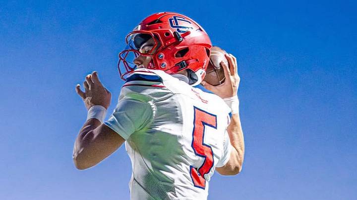 Central Catholic quarterback Caden Smith (5), a Bentley commit, passed for 245 yards, rushed for 162 yards and six total touchdowns. His team needed every one to knock off Xaverian, 52-51.