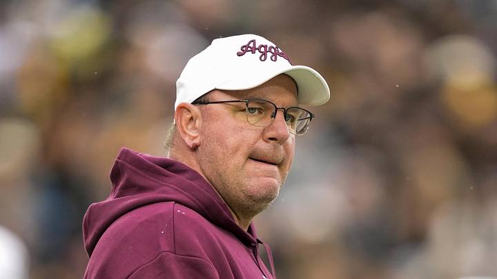 Texas A&M Aggies head coach Mike Elko watches warmups prior to a game against the Missouri Tigers at Faurot Field at Memorial Stadium.
