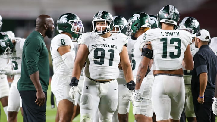 Michigan State DT Alex VanSumeren (91) patrols the sidelines with some of his teammates during the Spartans' game against USC on Sept. 20, 2025.
