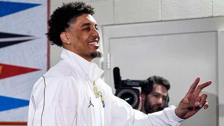 Michigan forward Yaxel Lendeborg (23) walks towards the locker room as the team arrive for the national championship game at Lucas Oil Stadium in Indianapolis on Monday, April 6, 2026.