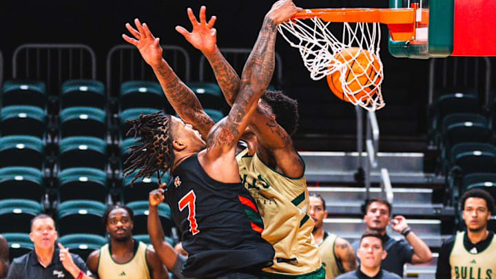 Miami Freshman Shelton Henderson Dunking on a USF player in a scrimmage. Miami Freshman Shelton Henderson Dunking on a USF player in a scrimmage.