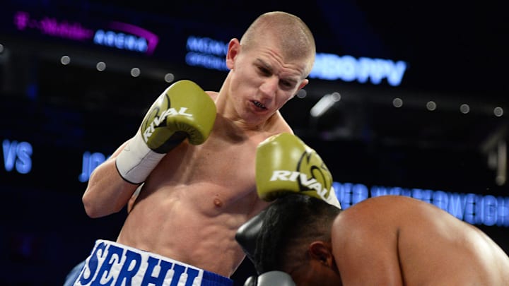 Sep 16, 2017; Las Vegas, NV, USA; Serhii Bohachuk (white trunks) and John Valenzuela (purple trunks) box during their bout at T-Mobile Arena. Bohachuk won via second round TKO. Mandatory Credit: Joe Camporeale-Imagn Images