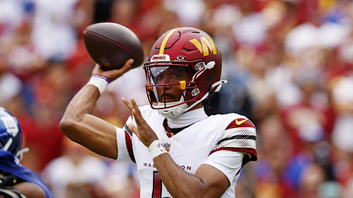 Sep 7, 2025; Landover, Maryland, USA; Washington Commanders quarterback Jayden Daniels (5) makes a pass during the first quarter against the New York Giants at Northwest Stadium. Mandatory Credit: Peter Casey-Imagn Images