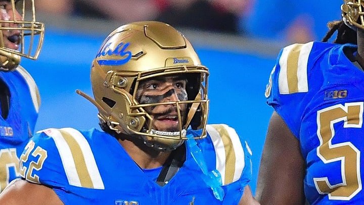 Nov 8, 2025; Pasadena, California, USA; UCLA Bruins running back Anthony Frias II (22) celebrates his touchdown scored against the Nebraska Cornhuskers with offensive lineman Julian Armella (74) during the second half at the Rose Bowl. Mandatory Credit: Gary A. Vasquez-Imagn Images Nov 8, 2025; Pasadena, California, USA; UCLA Bruins running back Anthony Frias II (22) celebrates his touchdown scored against the Nebraska Cornhuskers with offensive lineman Julian Armella (74) during the second half at the Rose Bowl. Mandatory Credit: Gary A. Vasquez-Imagn Images