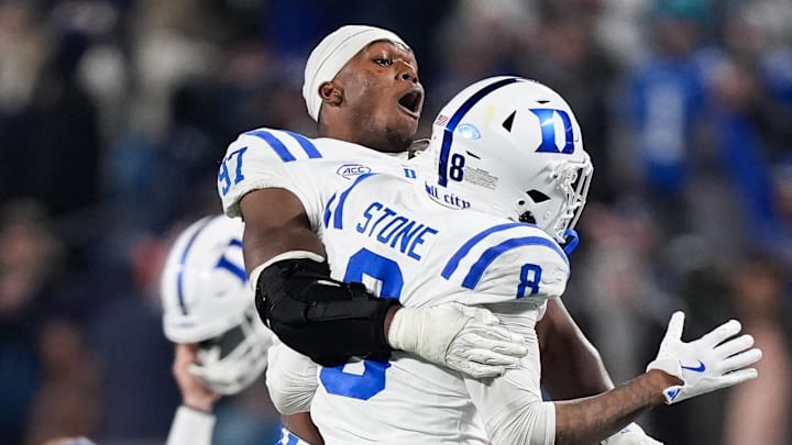 Dec 6, 2025; Charlotte, NC, USA; Duke Blue Devils defensive end Wesley Williams (97) celebrates with safety DaShawn Stone (8) after defeating the Virginia Cavaliers during the 2025 ACC Championship game at Bank of America Stadium. Mandatory Credit: Jim Dedmon-Imagn Images Dec 6, 2025; Charlotte, NC, USA; Duke Blue Devils defensive end Wesley Williams (97) celebrates with safety DaShawn Stone (8) after defeating the Virginia Cavaliers during the 2025 ACC Championship game at Bank of America Stadium. Mandatory Credit: Jim Dedmon-Imagn Images