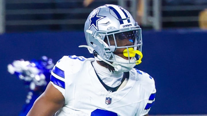 Nov 23, 2025; Arlington, Texas, USA; Dallas Cowboys wide receiver George Pickens (3) reacts after making a catch over Philadelphia Eagles cornerback Cooper DeJean (33) and Philadelphia Eagles safety Sydney Brown (21) during the game at AT&T Stadium. Mandatory Credit: Kevin Jairaj-Imagn Images