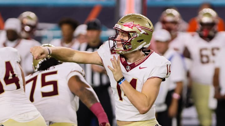 Oct 26, 2024; Miami Gardens, Florida, USA; Florida State Seminoles quarterback Luke Kromenhoek (14) throws the football against the Miami Hurricanes during the third quarter at Hard Rock Stadium. Mandatory Credit: Sam Navarro-Imagn Images