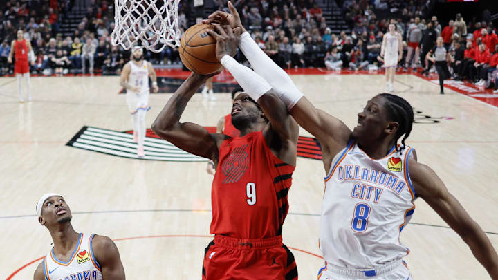 Mar 6, 2024; Portland, Oregon, USA; Portland Trail Blazers small forward Jerami Grant (9) shoots the ball against Oklahoma City Thunder forward Jalen Williams (8) during the second half at Moda Center. Mandatory Credit: Soobum Im-Imagn Images